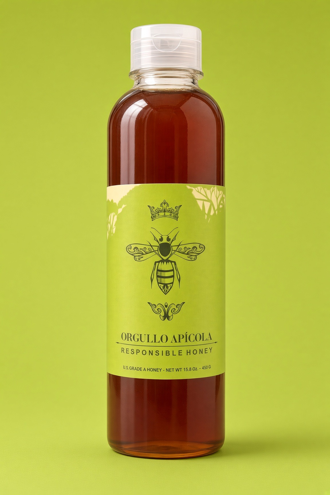 A slim squeeze bottle of amber honey with a sage label and a crowned bee